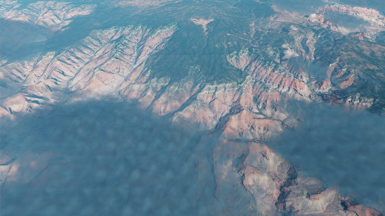 The Grand Canyon from above with a cloud deck and its shadows